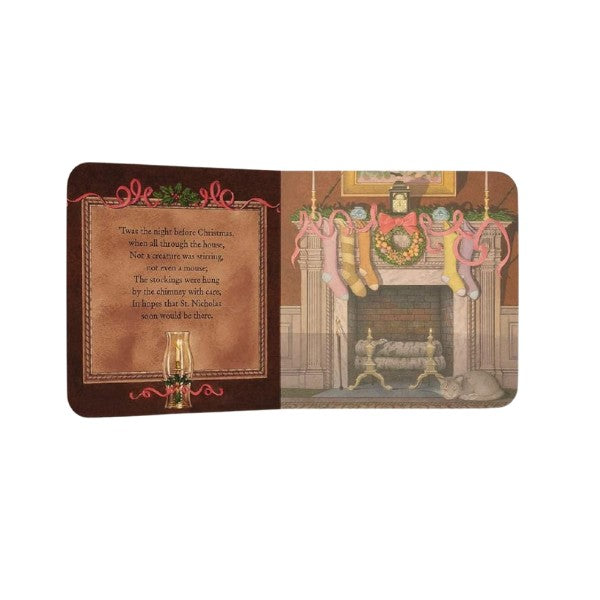 Colorful inside page of The Night Before Christmas oversized padded board book, depicting Santa entering the house and family gathered for Christmas Eve, illustrated by Charles Santore.